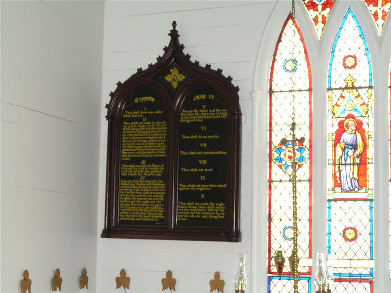 A view of the Ten Commandments tablet and the stain glass window in memory of John Slade located in Twillingate, Newfoundland, Canada.